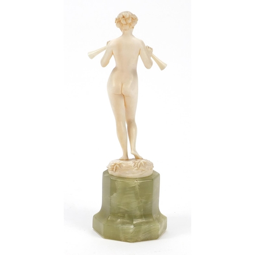 5 - WITHDRAWN - Art Deco ivory figurine of a standing nude female holding two horns, raised on a rectago... 
