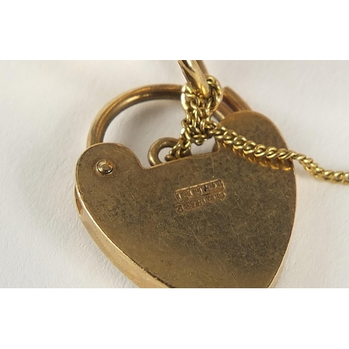 36 - 9ct gold eleven row gate bracelet with love heart shaped padlock, 18cm in length x 4cm wide, 31.5g