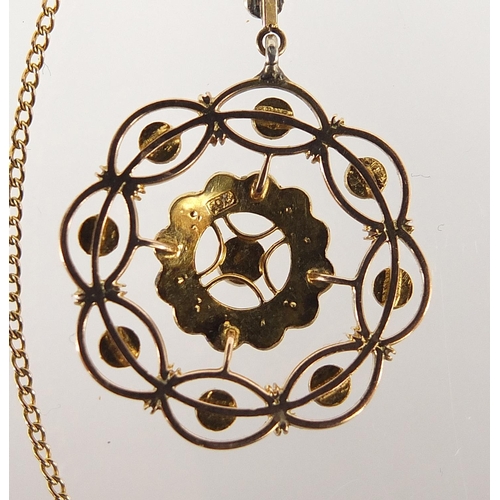 132 - 9ct gold seed pearl pendant on a 9ct gold necklace, housed in a velvet and silk lined fitted box, 5c... 