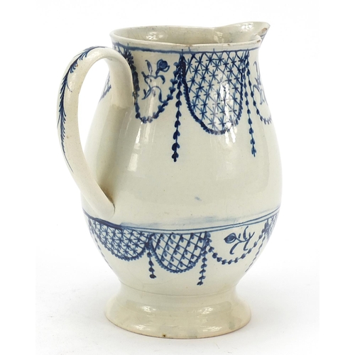 142 - Late 18th century pearlware jug hand painted with flowers, 17cm high