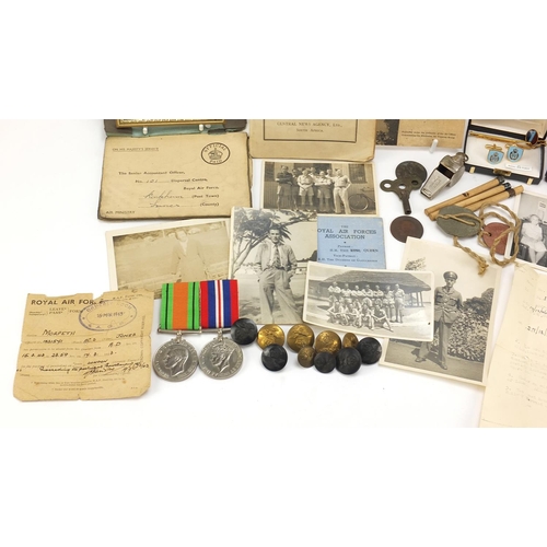 1357 - Militaria including two World War II medals, photographs and a Rhodesia and the RAF book