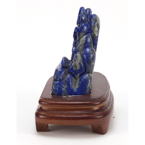 2179 - Chinese lapis lazuli landscape carving raised on a wood base, 16cm high