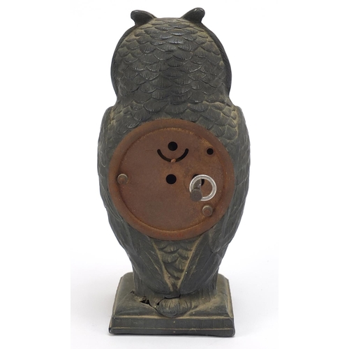 74 - Patinated spelter owl design desk clock with circular dial having Arabic numerals, 17cm high