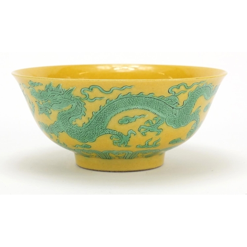 2175 - Chinese yellow ground porcelain bowl hand painted in green with dragons chasing a flaming pearl amon... 