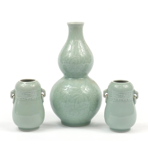 224 - Three Chinese celadon glaze vases comprising a pair and double gourd example incised with flowers, t... 