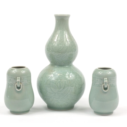 224 - Three Chinese celadon glaze vases comprising a pair and double gourd example incised with flowers, t... 
