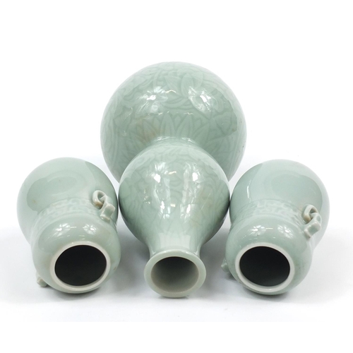 224 - Three Chinese celadon glaze vases comprising a pair and double gourd example incised with flowers, t... 