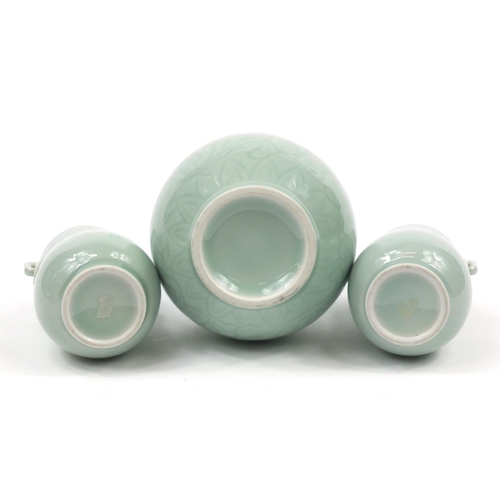 224 - Three Chinese celadon glaze vases comprising a pair and double gourd example incised with flowers, t... 