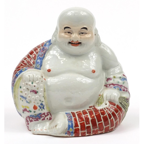 25 - Chinese porcelain figure of Buddha hand painted in the famille rose palette, 20cm high