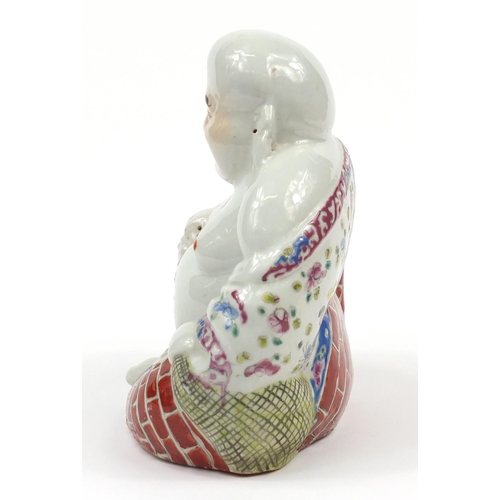 25 - Chinese porcelain figure of Buddha hand painted in the famille rose palette, 20cm high