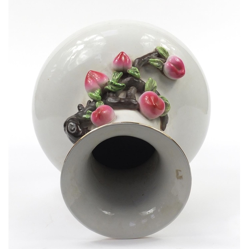 164 - Large Chinese porcelain vase decorated in relief with peaches, character marks to the base, 49cm hig... 