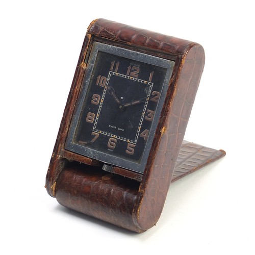 75 - Jaeger LeCoultre eight day travel clock with faux crocodile skin leather case, 10.5cm high