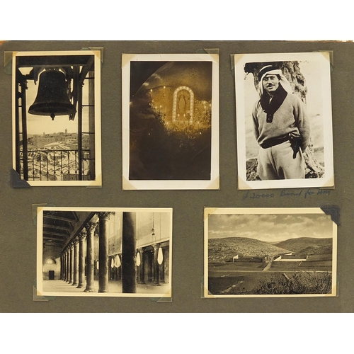 2199 - Military interest black and white photographs and postcards arranged in an album including Palestine... 