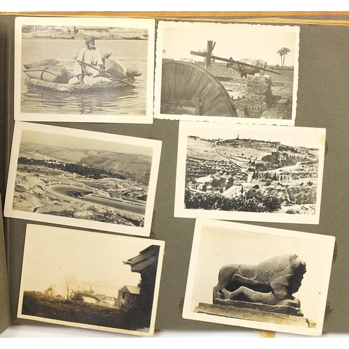 2199 - Military interest black and white photographs and postcards arranged in an album including Palestine... 