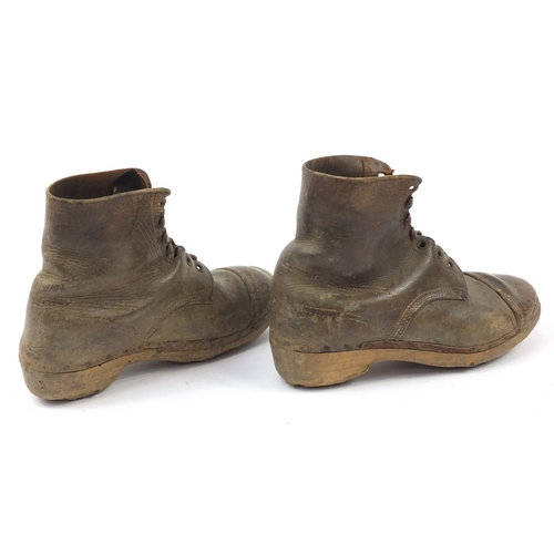 2189 - Pair of antique leather football boots with wooden soles