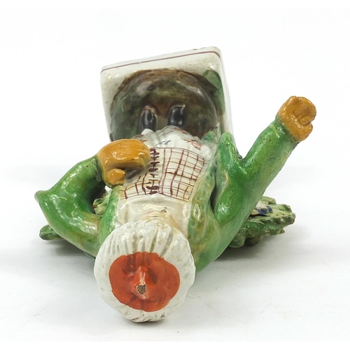 143 - 18th century Pearlware figure in Turkish costume wearing a turban, 15.5cm high