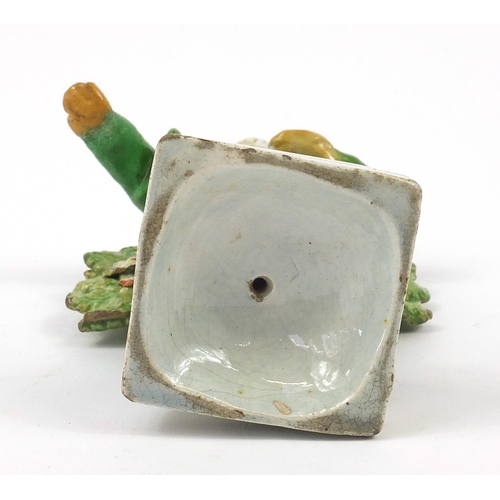 143 - 18th century Pearlware figure in Turkish costume wearing a turban, 15.5cm high