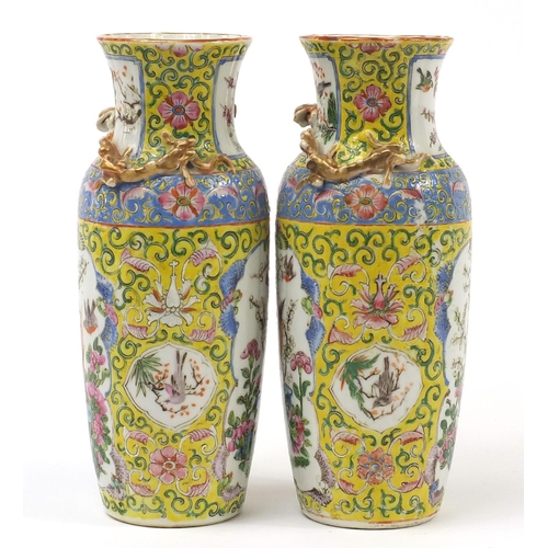 221 - Pair of Chinese porcelain yellow ground vases decorated in relief with water dragons, each hand pain... 