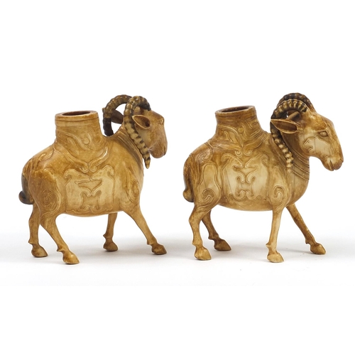 12 - Pair of 19th century European ivory goat match holders carved with animals, each 9cm in length