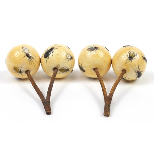 29 - Pair of Japanese carved ivory Shibayama cherries inlaid with insects, each 9cm in length