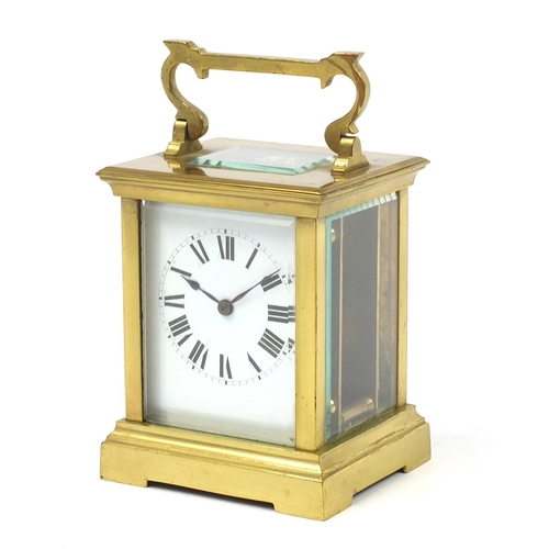 73 - Large brass cased carriage clock with enamel dial having Roman numerals, 12cm high