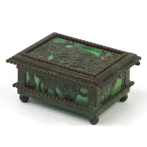 68 - Riviera Studios, American Art Nouveau bronze and slag glass double stamp box on ball feet, 8.5cm wid... 