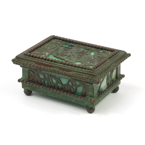 68 - Riviera Studios, American Art Nouveau bronze and slag glass double stamp box on ball feet, 8.5cm wid... 