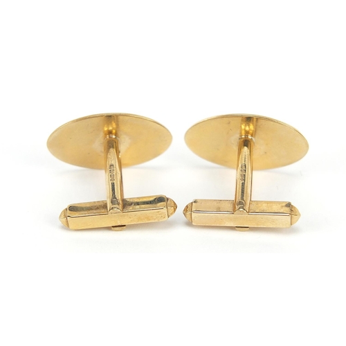 238 - Pair of 9ct gold cufflinks with engraved decoration, 2cm in length, 6.2g