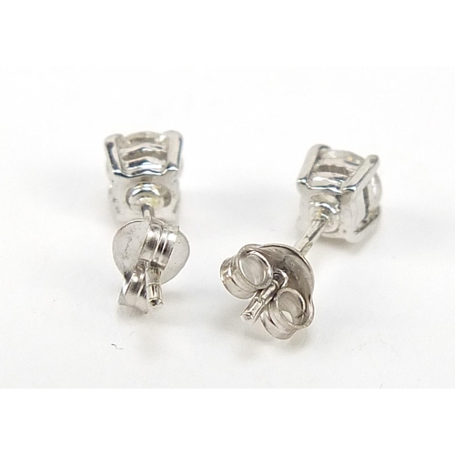 131 - Pair of 18ct white gold diamond solitaire stud earrings, approximately 4.4mm in diameter, 1.3g