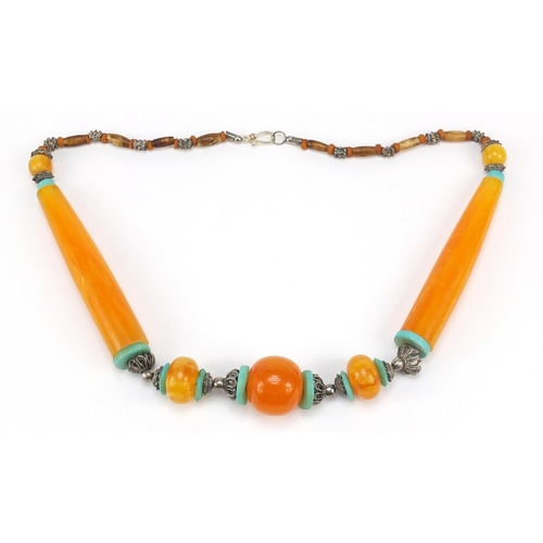 3026 - Islamic amber and turquoise coloured bead necklace with silver coloured metal mounts, 60cm in length