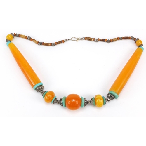 3026 - Islamic amber and turquoise coloured bead necklace with silver coloured metal mounts, 60cm in length