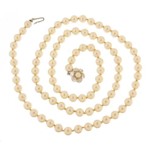 3030 - Simulated pearl necklace with silver clasp housed in a Mikimoto Pearls box, 70cm in length, 48.8g