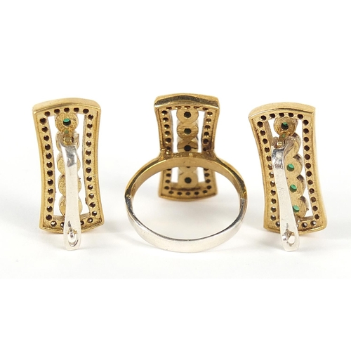 2210 - Designer silver gilt green and clear stone ring and earrings, the ring size R, the earrings 2.5cm hi... 