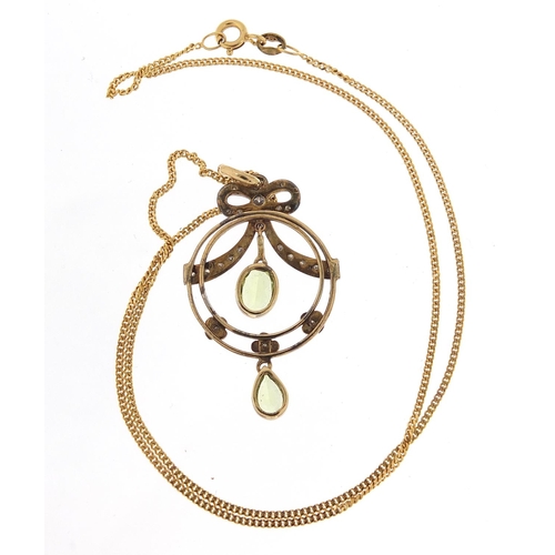 35 - Art Nouveau 9ct gold peridot and diamond pendant on a 9ct gold necklace, housed in a Victorian velve... 