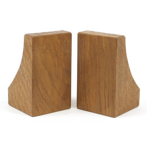 64 - Robert Mouseman Thompson, pair of adzed oak book ends, each carved with a mouse, each 15.5cm high