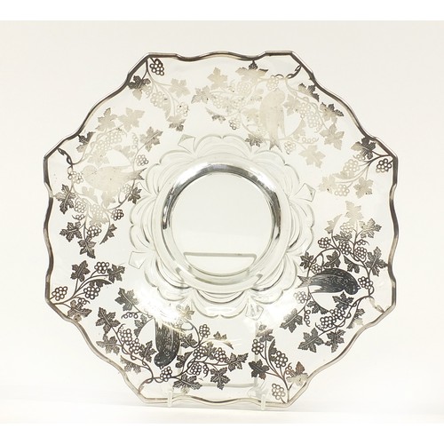 67 - Early 20th century silver overlaid glass bowl decorated with birds amongst foliage, 33.5cm in diamet... 