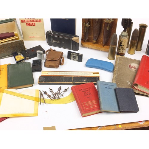 3045 - Sundry items including ephemera, military trench shells and decorative knives on stand
