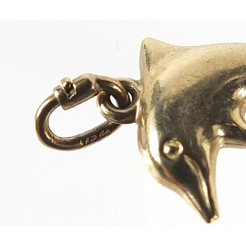 782 - Two 9ct gold dolphin pendants, 2.6cm and 2.2cm high, total 1.2g