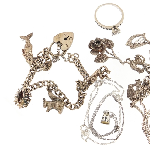 1149 - Silver jewellery including two charm bracelets, cameo pendant and a clear stone ring, 55.0g