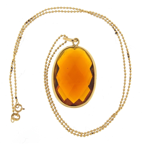 165 - Citrine pendant with gold coloured metal mount on a 18ct gold ball link necklace, the pendant 4cm hi... 