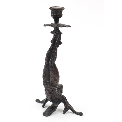 150 - Patinated bronze candlestick in the form of a Chinese acrobat, 25cm high