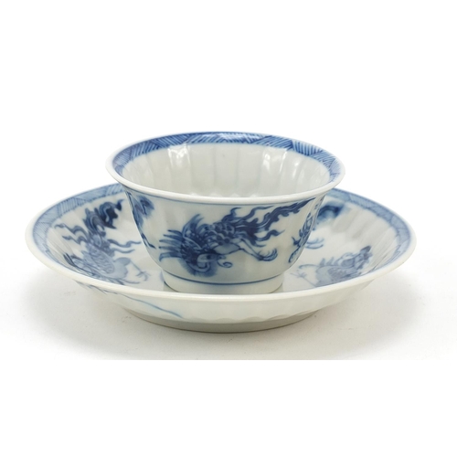 99 - Chinese blue and white porcelain tea bowl with saucer, hand painted with phoenixes, the saucer 12.5c... 