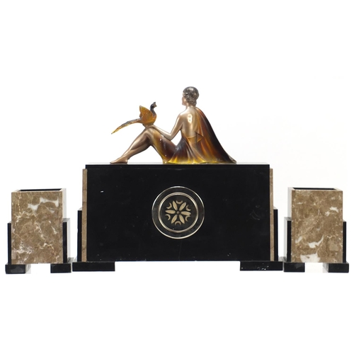 309 - French Art Deco black slate, marble and onyx mantle clock with garniture vases, the mantle clock sur... 