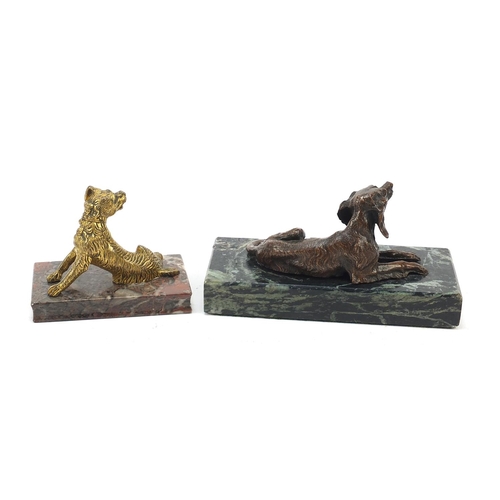 519 - Two marble sculptures surmounted with dogs including a bronze example of a Spaniel, the largest 15cm... 