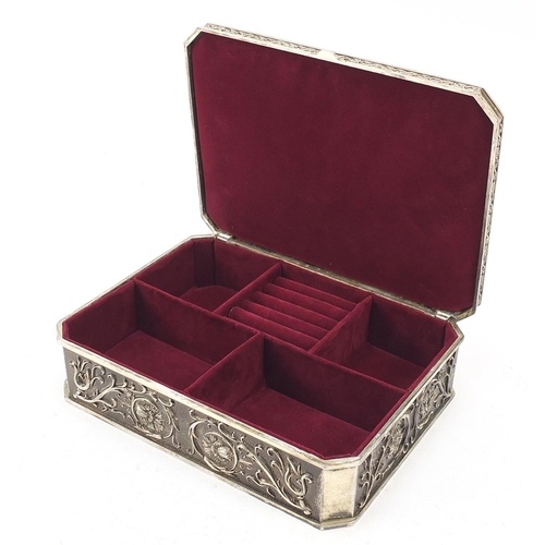 520 - Classical silver plated jewellery box with canted corners, decorated in relief with Putti amongst fl... 