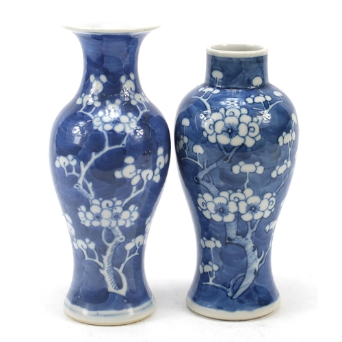 89 - Two Chinese porcelain blue and white porcelain vases hand painted with prunus flowers, each with blu... 