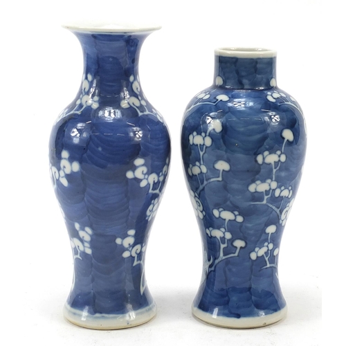 89 - Two Chinese porcelain blue and white porcelain vases hand painted with prunus flowers, each with blu... 