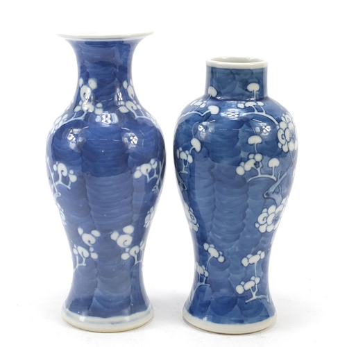 89 - Two Chinese porcelain blue and white porcelain vases hand painted with prunus flowers, each with blu... 