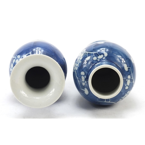 89 - Two Chinese porcelain blue and white porcelain vases hand painted with prunus flowers, each with blu... 