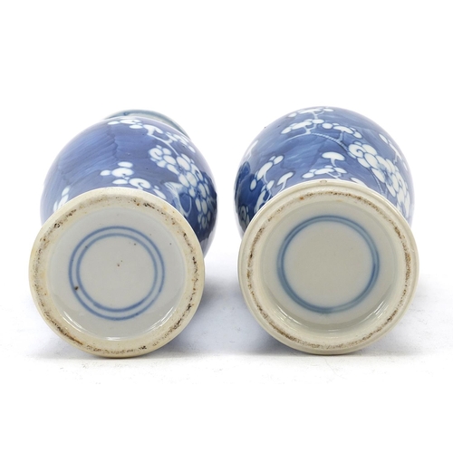 89 - Two Chinese porcelain blue and white porcelain vases hand painted with prunus flowers, each with blu... 